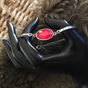Silver tone faceted oval cut faux ruby bracelet